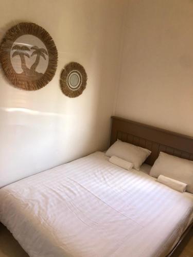 Ліжко або ліжка в номері NOMAD Tropical Hostel Canggu