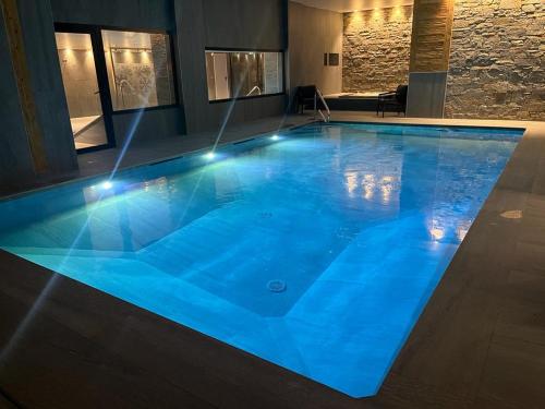 Swimmingpoolen hos eller tæt på Hôtel Alpina & SPA - Restaurant Oxalis