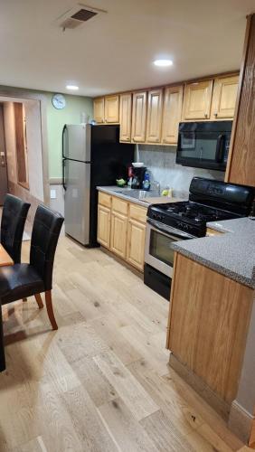 A kitchen or kitchenette at Two Bedroom Few Blocks From The Beach And Tropicana Casino