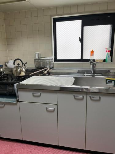 Una cocina o kitchenette en 民泊くるり