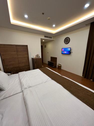 Una cama o camas en una habitación de Soulmate Hotel Erbil