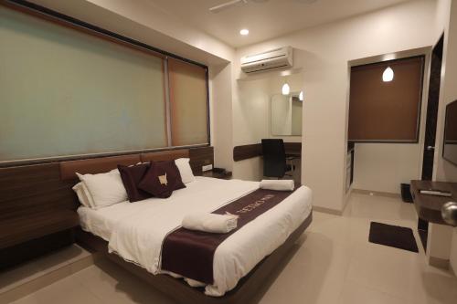 Tempat tidur dalam kamar di Hotel Vetro Inn