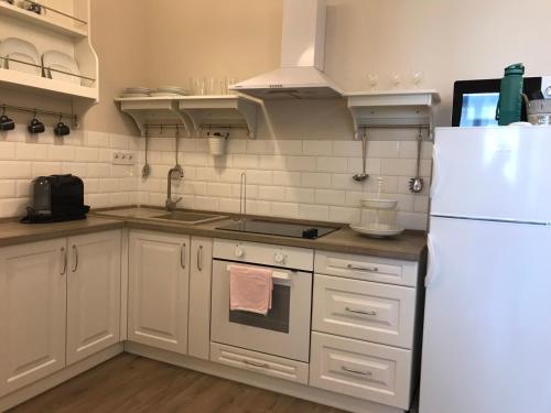 A kitchen or kitchenette at S2 Apartman