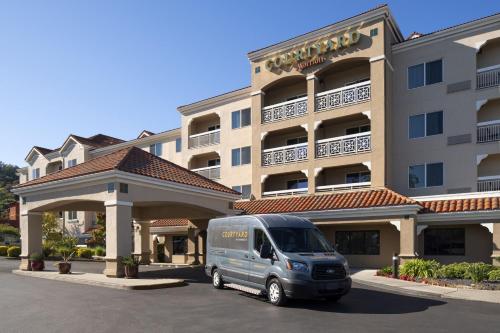 a van parked in front of a hotel at Courtyard Novato Marin/Sonoma in Novato