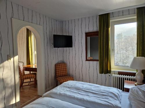 Säng eller sängar i ett rum på Harz Hotel Waldhaus