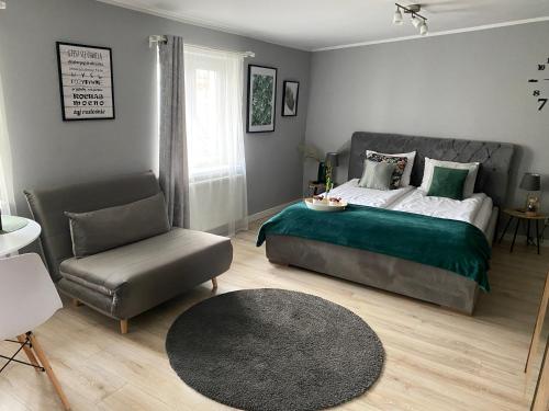 Кровать или кровати в номере Apartament Blue Lagoon