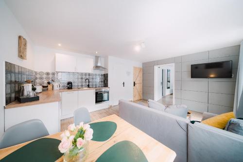 a living room with a couch and a table at Black Forest Dream Apartments in Feldberg