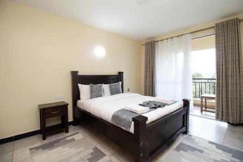 Voodi või voodid majutusasutuse Arabel 1 Bedroom D5 Kishan Towers, Nanyuki toas