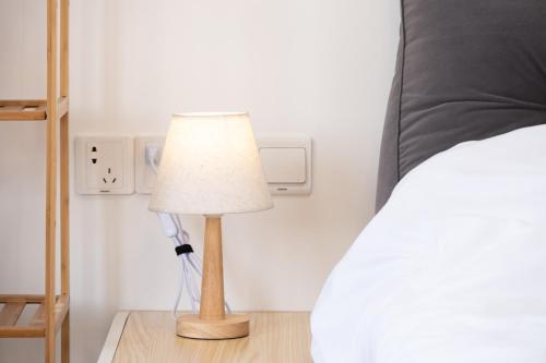 A bed or beds in a room at 1930 French Minimalist Apartment