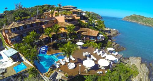 an aerial view of the resort and the ocean at Hotel Ferradura Private in Búzios