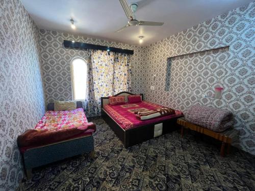 Gulta vai gultas numurā naktsmītnē Hotel Kashmir Heaven