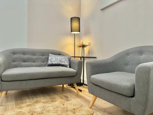 a living room with a couch and a chair at LOFT CENTRE SANTANDER in Santander