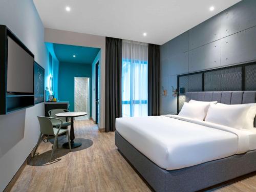 Cama ou camas em um quarto em ibis Styles Sepang KLIA