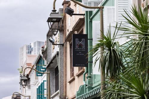 a sign on the side of a building at NEWLY REFURBISHED - Heritage Collection on Ann Siang in Singapore