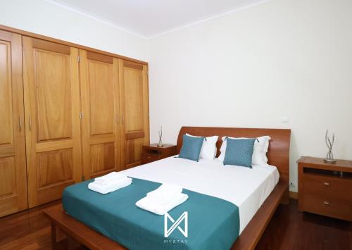 Una cama o camas en una habitación de MyStay - Lagos House