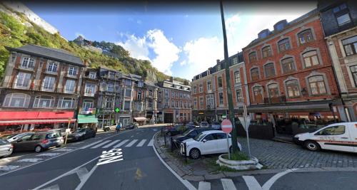 a city street with cars parked on the side of the road at NOMAD APARTMENTS - Astrid in Dinant