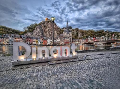 a large sign that says dordogne in front of a city at NOMAD APARTMENTS - Astrid in Dinant