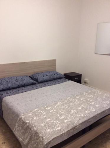 Una cama o camas en una habitación de CasaGiulia2Apartament