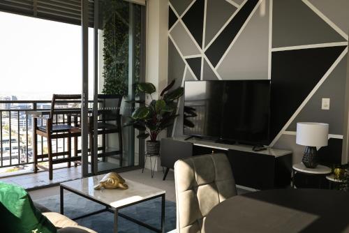 Televisor o centre d'entreteniment de River view apartment in Brisbane with parking