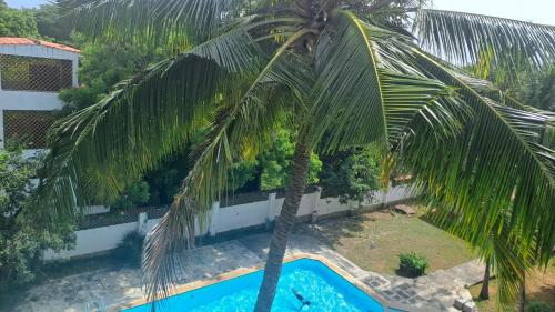 A piscina localizada em Ary Homestay Nyali - On Corral Drive ou nos arredores