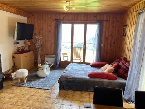 Krevet ili kreveti u jedinici u okviru objekta Chalet Le Petit Foyer