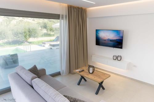 אזור ישיבה ב-Anthelia Luxury Villas