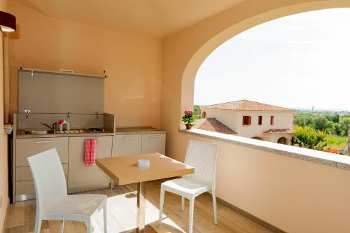 A balcony or terrace at MOLAROTTO CAMERE CON ANGOLO COTTURA