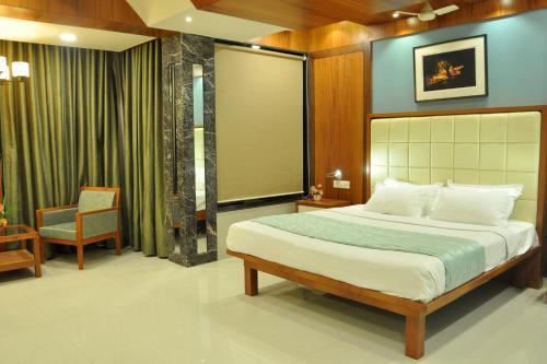 Tempat tidur dalam kamar di Panaji Residency