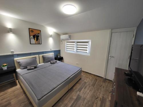 Cama o camas de una habitación en Guesthouse Ožegović