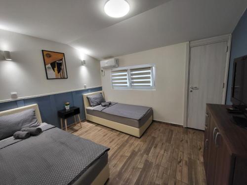 Cama o camas de una habitación en Guesthouse Ožegović