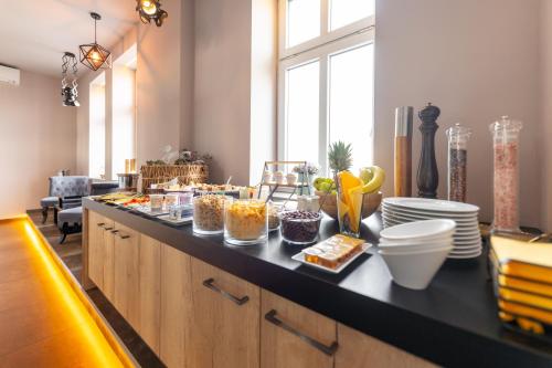 a kitchen with a counter with food on it at Pension Padre in Ostrava