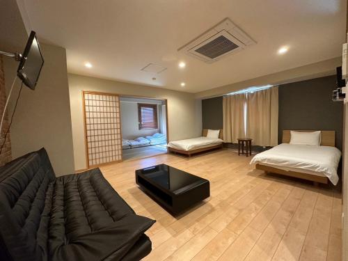 guest house shimanouchi 객실 침대