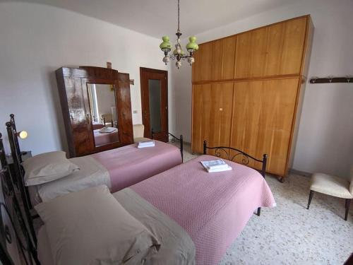 Una cama o camas en una habitación de Casa Vacanze Farinella