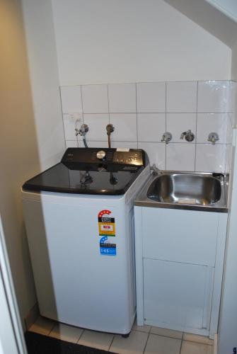 Virtuvė arba virtuvėlė apgyvendinimo įstaigoje 24 Gillies St Apartment