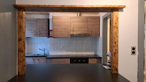 Una cocina o cocineta en Appartement de vacances Les Jardins