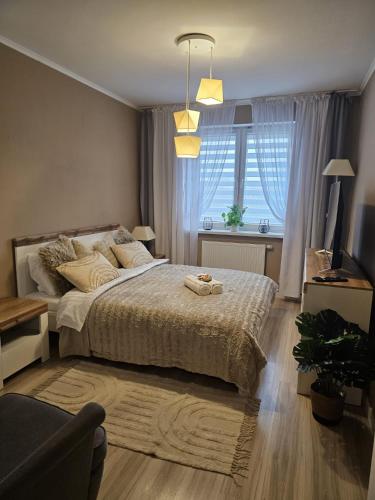 Cama ou camas em um quarto em 2 Bed Apartment in Zyrardow