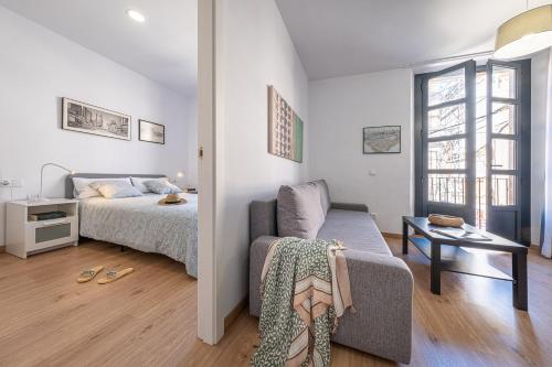 Cama ou camas em um quarto em Tarragona Apartments