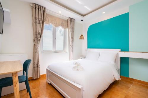 Tempat tidur dalam kamar di Bãi Dâu Stop & Go Hotel Vũng Tàu