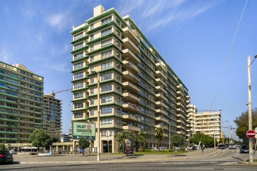 a tall apartment building on a city street at Luxury Living by the Sea Matosinhos Marvel in Matosinhos