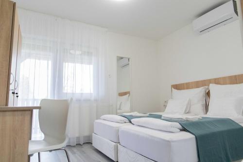 Cama ou camas em um quarto em Farkas Villa Apartmanok