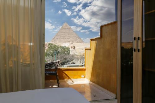 Giza Pyramids View Inn 객실 침대