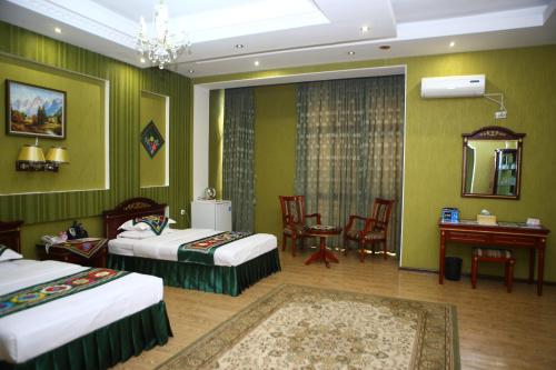 ORIYO DUSHANBE HOTEL में एक कमरे में एक या कई बेड