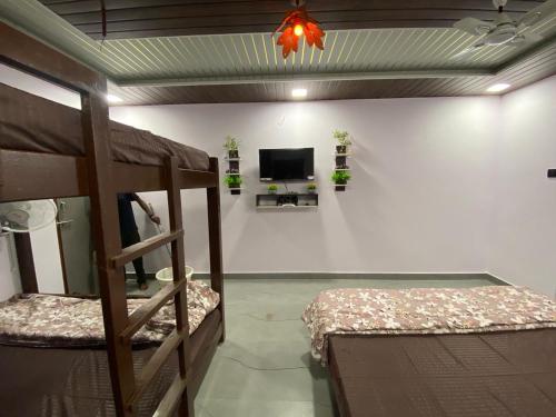 Tempat tidur dalam kamar di Rock n Ocean2 , Beach stay