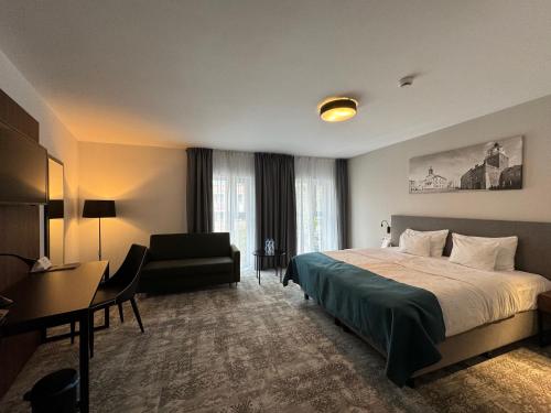 Ліжко або ліжка в номері Focus Hotel Premium Lublin