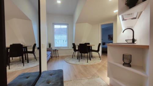 a kitchen and living room with a table and chairs at G-47 Near the Parliament in Vilnius