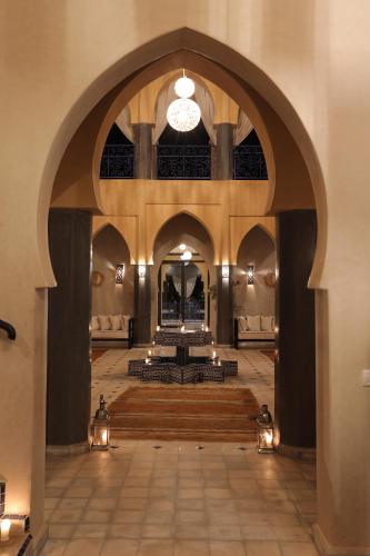 a large room with an archway in a building at Atlas Widan in Marrakech