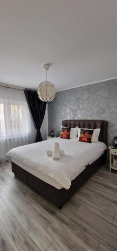 Katil atau katil-katil dalam bilik di Apartament Central Iulia