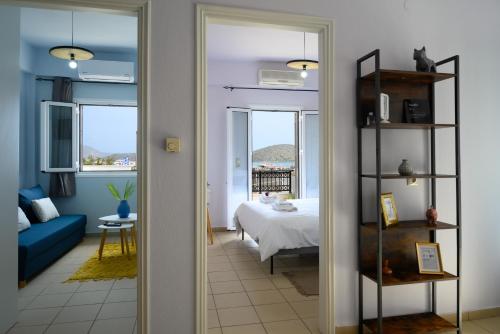 A bed or beds in a room at Elounda Luso Apartment