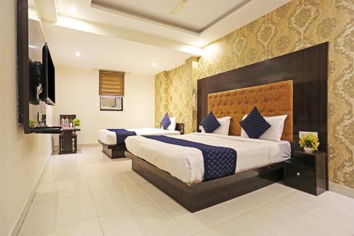 A bed or beds in a room at Hotel Iconic IGI Delhi International Airport