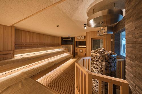 a tasting room with wood paneling and a vaulted ceiling at Sauna & Capsule Hotel Rumor Plaza in Kyoto